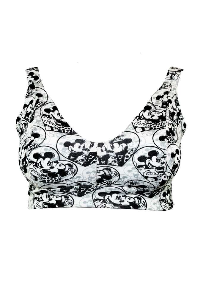 Add a dose of classic romance to your undies drawer with our Mickey and Minnie In Love Wireless Comfort Bra. This nostalgic print is all about soft support, sweet vibes, and a little cartoon chaos. Featuring the iconic couple in cute, flirty moments, this bra brings a playful touch to your everyday comfort.

Designed for F to O cup sizes, it’s wire-free, tag-free, and made from soft organic cotton — ideal for sensory-friendly wear. Gender inclusive and handmade in Scotland, it’s perfect for anyone who wants