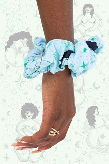 Wilde Mode x Fat Lemon Mint Celestial Beauties Hair Scrunchie shown on a blue background