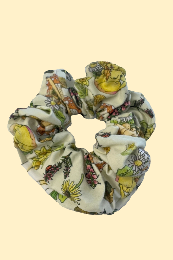 White floral cottage core hair scrunchie, with naked ladies and daisies printed. Sustainably made from fabric off-cuts from Wilde Mode Active and Loungewear collections