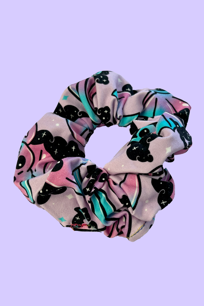 pastel purple and blue hair scrunchie with cute bat design all over. Sustainably made from fabric off-cuts from Wilde Mode Active and Loungewear collections