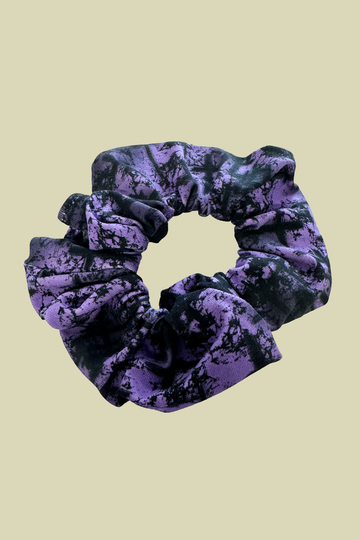 a purple scrunchie with cool black cross design on it. Sustainably made from fabric off-cuts from Wilde Mode Active and Loungewear collections