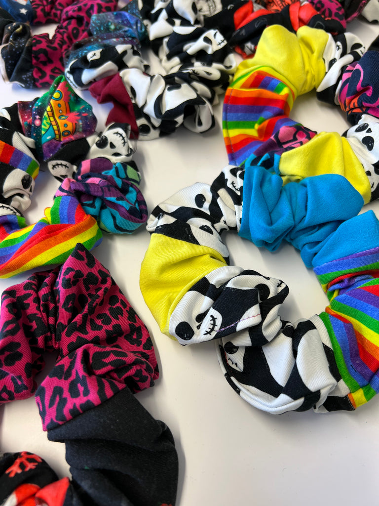 a handful of sustainable patchwork hair scrunchies. Each one is unique and made from various Wilde Mode fabric scraps