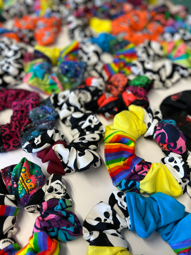 a handful of sustainable patchwork hair scrunchies. Each one is unique and made from various Wilde Mode fabric scraps